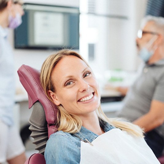 Woman smiling in the dental chair