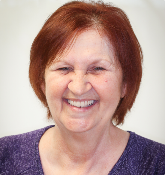 Smiling older redheaded woman