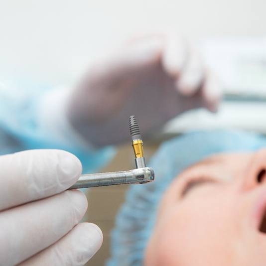 patient getting dental implant 