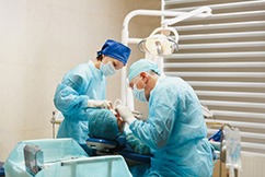 Oral surgery team working on patient