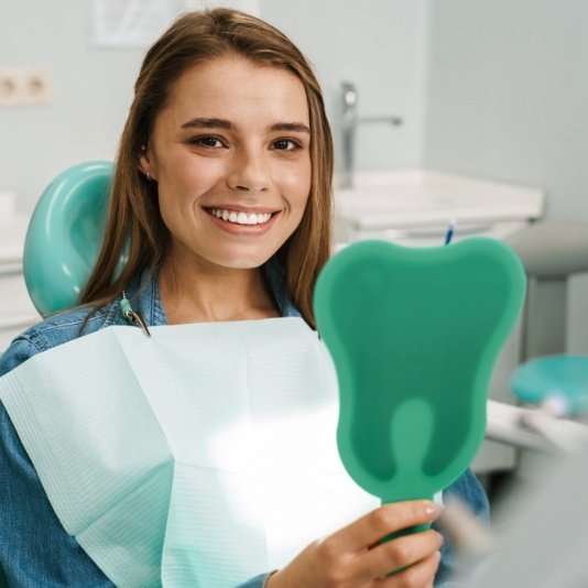 Young woman smiling after non invasive dental treatments in Slidell